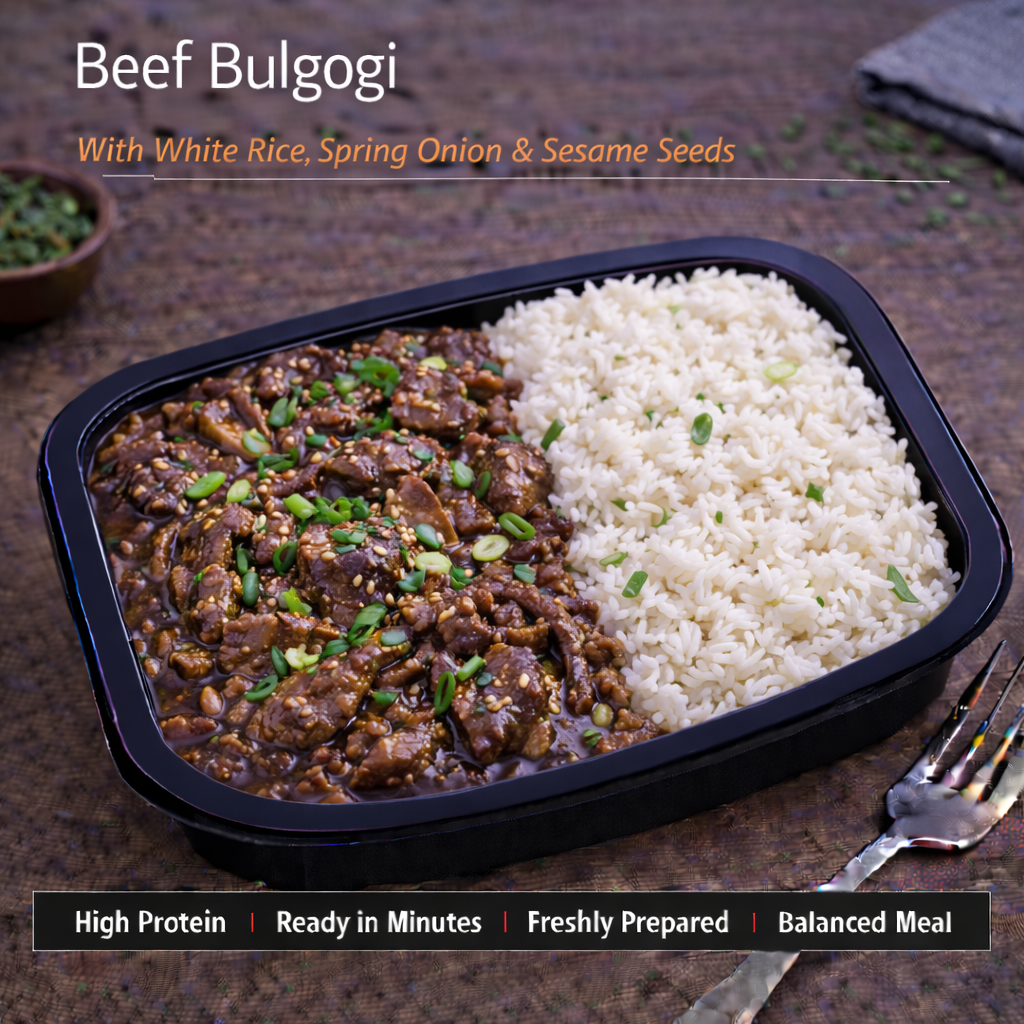 Beef Bulgogi served with white rice, topped with green onion and sesame seeds