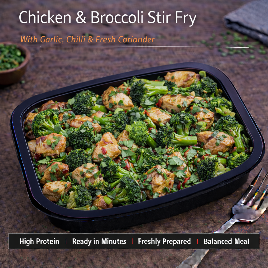 Chicken and broccoli stir fry with garlic and chilli, topped with coriander