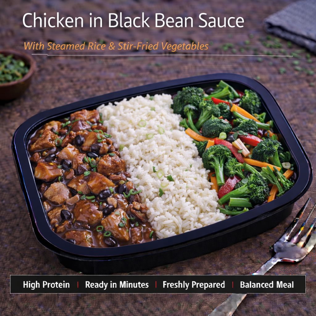 Chicken in black bean sauce with steamed rice and stir fried vegetables.